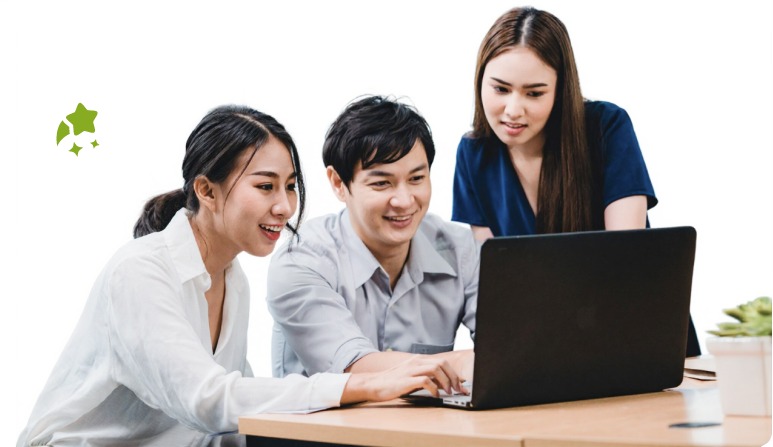 Diverse team collaborating on a laptop
